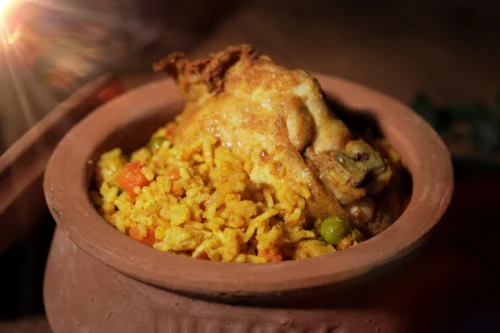 Delicious chicken biryani served in a traditional clay pot, showcasing vibrant colours and textures indicative of gourmet food photography.