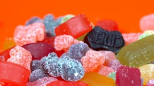 Colourful gummy candies of various shapes and sizes, showcasing a vibrant assortment ideal for product photography.